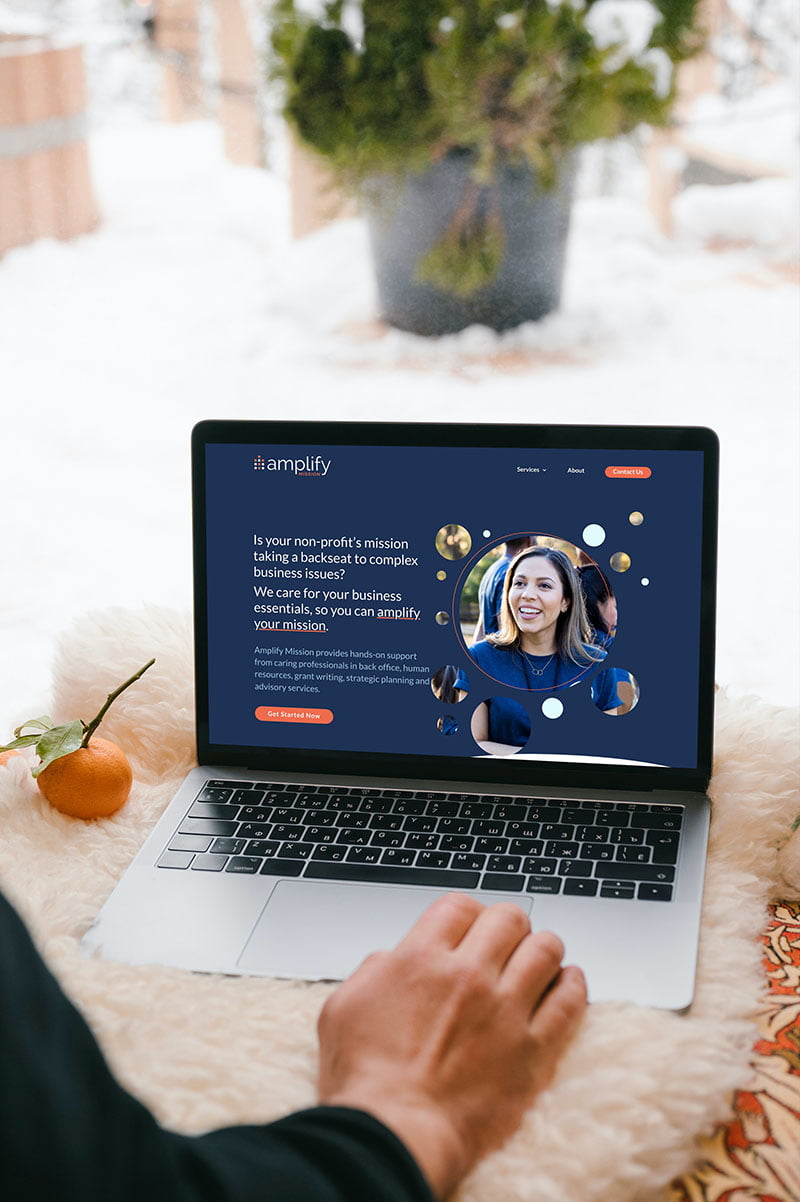 amplify-mission-website A woman using a computer