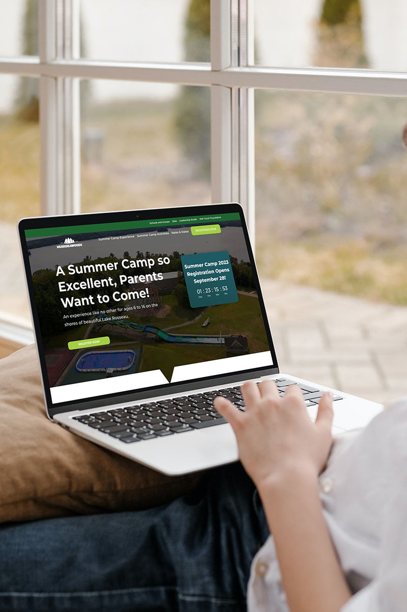 muskoka-woods-website A woman using a computer